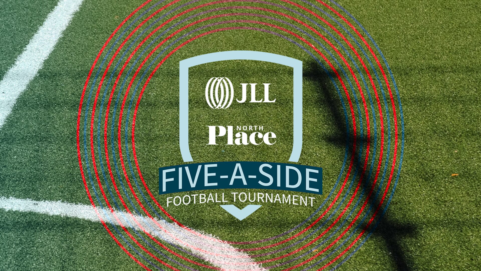Crest logo for the JLL Five-a-Side Football Tournament over the corner of a football pitch